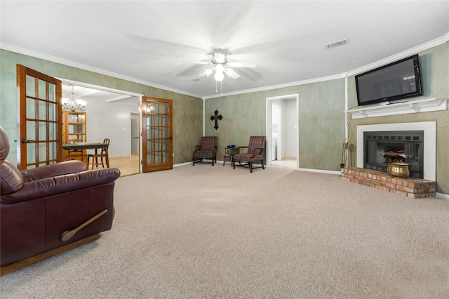 1305 Haines Dr, College Station, TX 77840 - living area featuring french doors, ceiling fan, ornamental molding, carpet, and a brick fireplace
