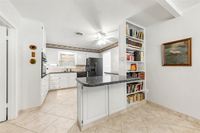 1305 Haines Dr, College Station, TX 77840 - kitchen featuring black appliances, a peninsula, white cabinetry, and open shelves