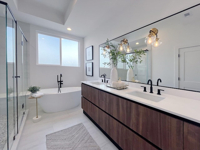 303F Marcella St, Houston, TX 77091 - full bathroom with double vanity, a stall shower, a freestanding bath, and recessed lighting