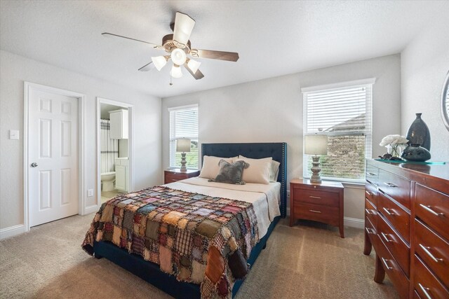 6903 Stevenson Dr, Missouri City, TX 77459 - bedroom with light carpet, a ceiling fan, and ensuite bathroom