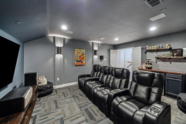 6903 Stevenson Dr, Missouri City, TX 77459 - cinema with recessed lighting, a textured ceiling, carpet floors, and a dry bar