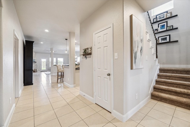 6903 Stevenson Dr, Missouri City, TX 77459 - foyer entrance with light tile patterned flooring, recessed lighting, and stairway