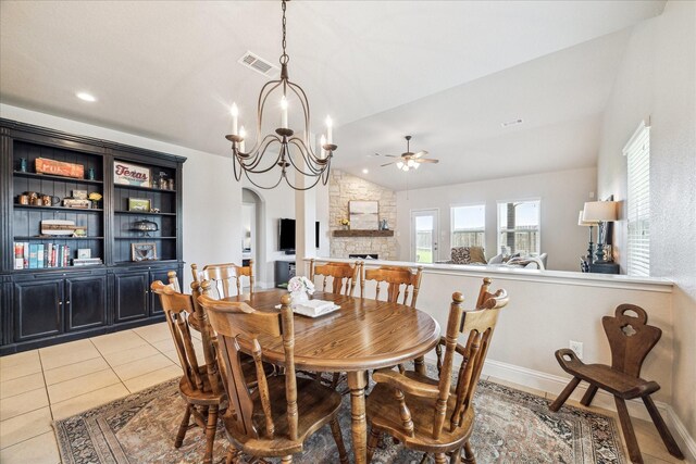 6903 Stevenson Dr, Missouri City, TX 77459 - dining room featuring lofted ceiling, ceiling fan, a chandelier, arched walkways, and light tile patterned flooring
