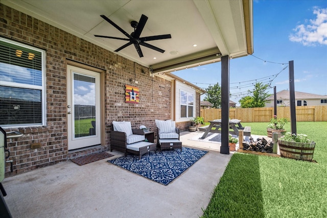 6903 Stevenson Dr, Missouri City, TX 77459 - fenced backyard featuring a patio, ceiling fan, and an outdoor living space
