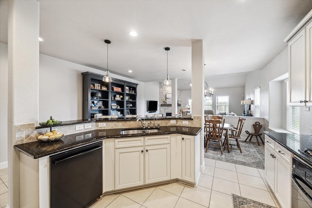 6903 Stevenson Dr, Missouri City, TX 77459 - kitchen with black appliances, open floor plan, light tile patterned floors, tasteful backsplash, and dark stone counters