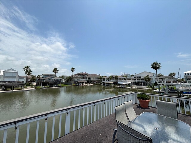 3514 Jolly Roger Cir, Galveston, TX 77554 - balcony with a water view, outdoor dining space, and a residential view