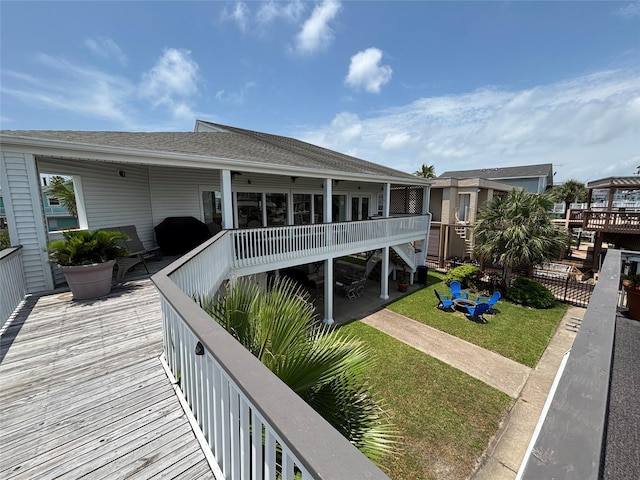 3514 Jolly Roger Cir, Galveston, TX 77554 - deck with stairs, a yard, and a grill