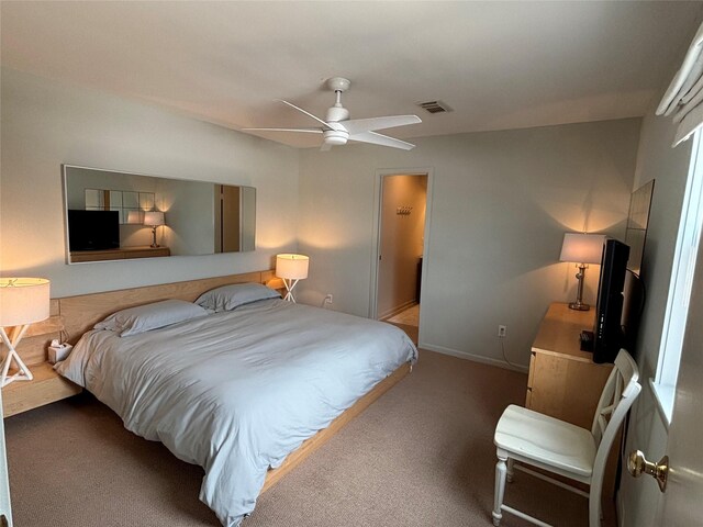3514 Jolly Roger Cir, Galveston, TX 77554 - bedroom with carpet and a ceiling fan