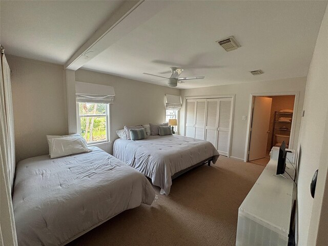 3514 Jolly Roger Cir, Galveston, TX 77554 - carpeted bedroom with a closet and a ceiling fan