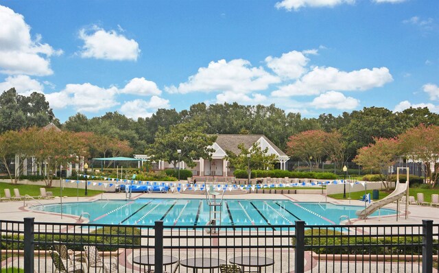 6403 Hidden Crest Way, Sugar Land, TX 77479 - community pool featuring a patio area and view of scattered trees