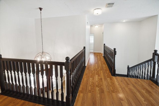 6403 Hidden Crest Way, Sugar Land, TX 77479 - hall featuring an upstairs landing, a chandelier, and wood finished floors