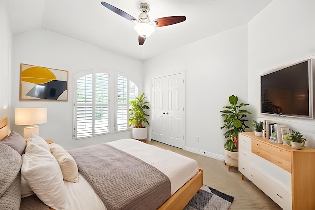 6403 Hidden Crest Way, Sugar Land, TX 77479 - bedroom with light colored carpet, lofted ceiling, a ceiling fan, and a closet