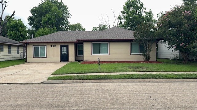 209 W 8th St, Deer Park, TX 77536 - single story home with driveway and a front yard