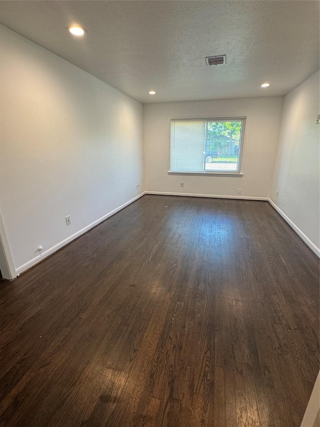 209 W 8th St, Deer Park, TX 77536 - spare room with dark wood-style flooring and recessed lighting