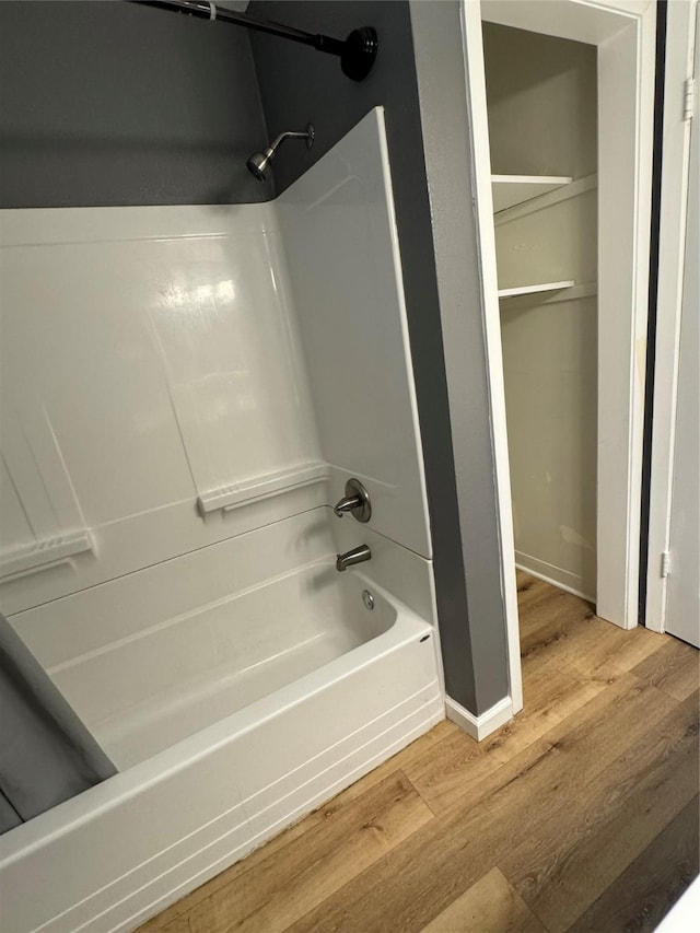 209 W 8th St, Deer Park, TX 77536 - bathroom with wood finished floors and washtub / shower combination
