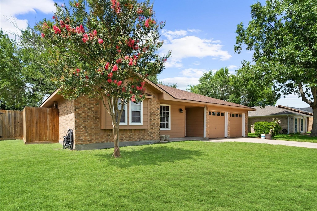 5915 Ray Dr, Pasadena, TX 77505 - ranch-style house featuring brick siding, a garage, and concrete driveway