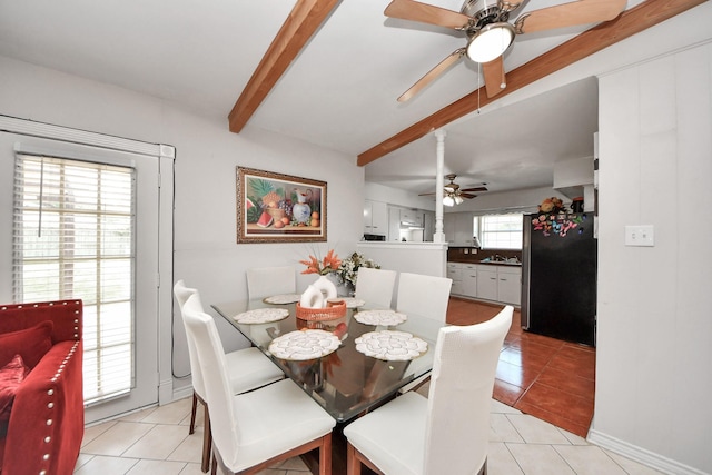 1903 Britton St, Baytown, TX 77520 - dining space featuring a ceiling fan, beam ceiling, and light tile patterned floors