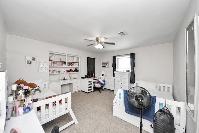 1903 Britton St, Baytown, TX 77520 - bedroom with a desk, light carpet, and a ceiling fan