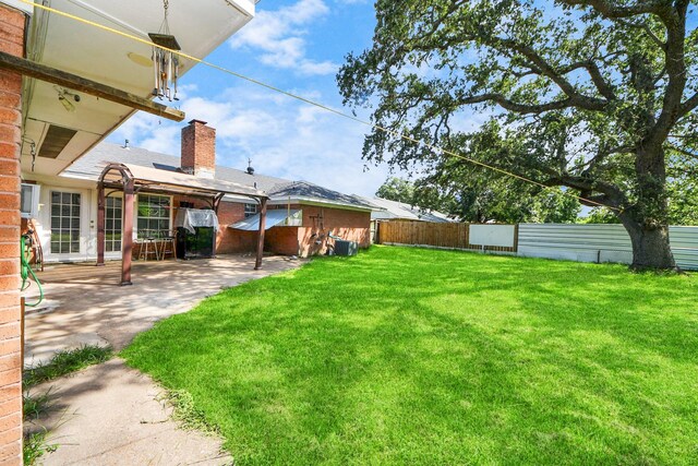 1903 Britton St, Baytown, TX 77520 - view of yard with a patio
