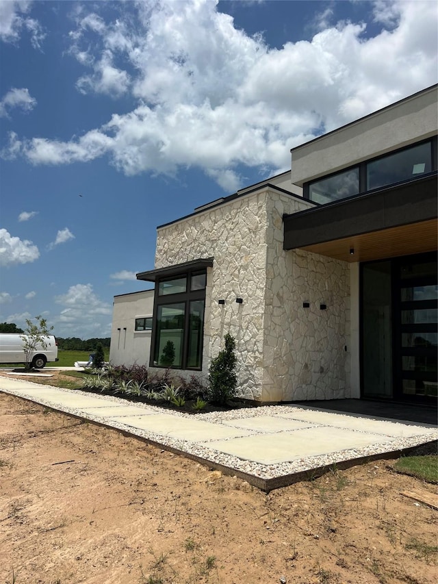 20410 Tealpointe Ridge Ln, Tomball, TX 77377 - back of property featuring stone siding