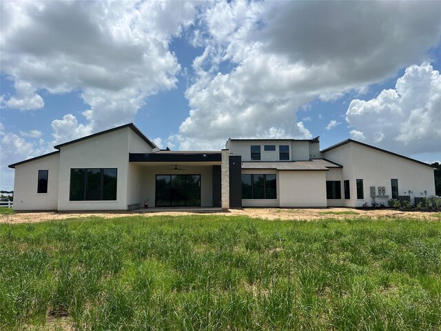 20410 Tealpointe Ridge Ln, Tomball, TX 77377 - rear view of house featuring a ceiling fan, stucco siding, and a patio area