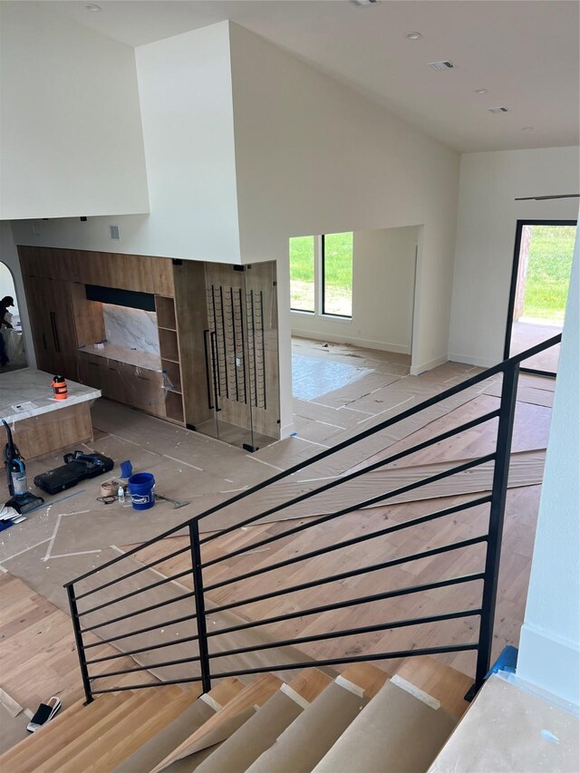 20410 Tealpointe Ridge Ln, Tomball, TX 77377 - stairway featuring vaulted ceiling and a fireplace