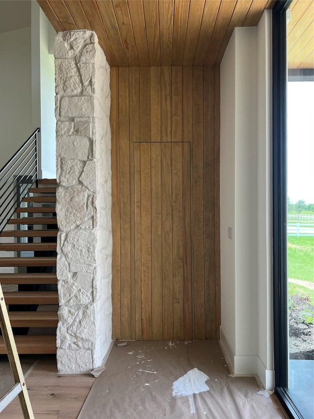 20410 Tealpointe Ridge Ln, Tomball, TX 77377 - interior space featuring wooden ceiling, wooden walls, and stairway