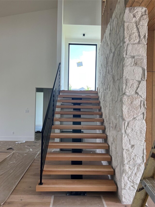 20410 Tealpointe Ridge Ln, Tomball, TX 77377 - stairway with wood finished floors and a high ceiling
