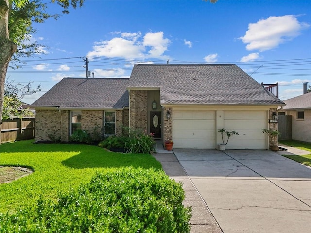 2004 Tuscarora Ct, League City, TX 77573 - view of front of house with driveway, roof with shingles, an attached garage, and brick siding