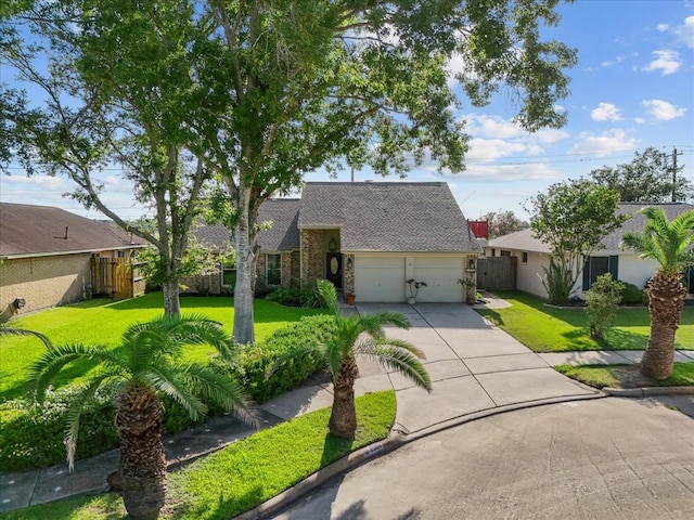 2004 Tuscarora Ct, League City, TX 77573 - traditional-style house with concrete driveway, an attached garage, and roof with shingles