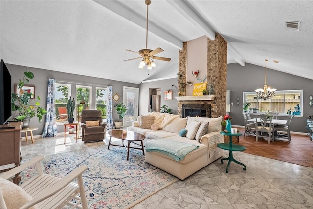 2004 Tuscarora Ct, League City, TX 77573 - living room featuring a textured ceiling, a large fireplace, ceiling fan, a chandelier, and marble finish flooring