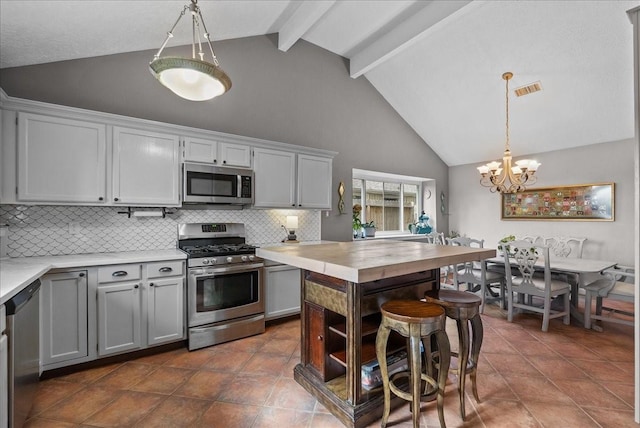 2004 Tuscarora Ct, League City, TX 77573 - kitchen featuring stainless steel appliances, decorative backsplash, high vaulted ceiling, beam ceiling, and a chandelier