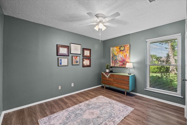 2004 Tuscarora Ct, League City, TX 77573 - office area featuring wood finished floors, a ceiling fan, and a textured ceiling