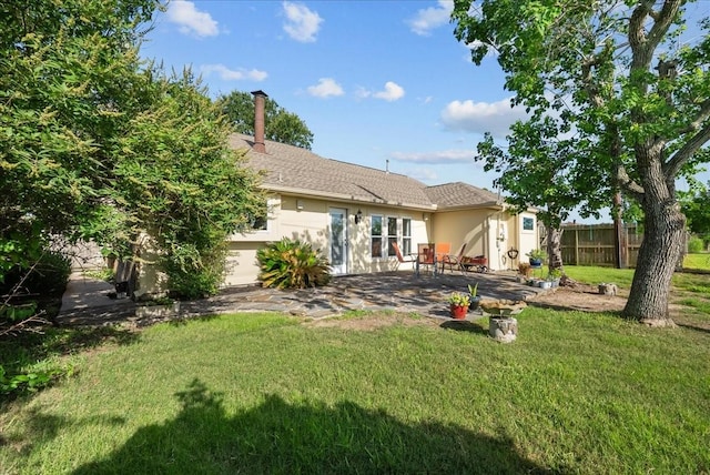 2004 Tuscarora Ct, League City, TX 77573 - rear view of house with a patio area, stucco siding, and a chimney