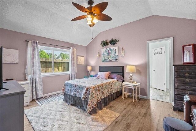 2004 Tuscarora Ct, League City, TX 77573 - bedroom featuring lofted ceiling, wood finished floors, a textured ceiling, and ceiling fan