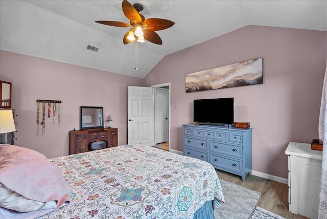 2004 Tuscarora Ct, League City, TX 77573 - bedroom with lofted ceiling, light wood-style flooring, and a ceiling fan