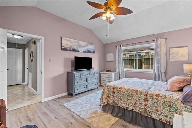 2004 Tuscarora Ct, League City, TX 77573 - bedroom with lofted ceiling, attic access, light wood-style floors, and a ceiling fan