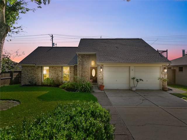 2004 Tuscarora Ct, League City, TX 77573 - view of front of house featuring concrete driveway, an attached garage, a shingled roof, and brick siding