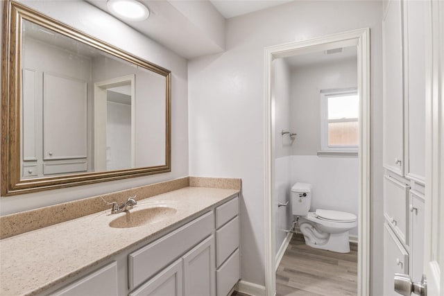 8302 Burning Hills Dr, Houston, TX 77071 - half bathroom featuring vanity and wood finished floors