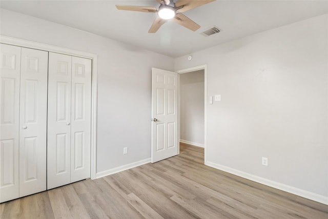 8302 Burning Hills Dr, Houston, TX 77071 - unfurnished bedroom with light wood finished floors, a closet, and a ceiling fan