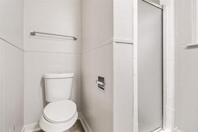 8302 Burning Hills Dr, Houston, TX 77071 - full bathroom with a stall shower and a wainscoted wall