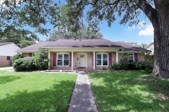 8302 Burning Hills Dr, Houston, TX 77071 - ranch-style home featuring a front lawn, brick siding, a shingled roof, and covered porch