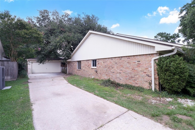 8302 Burning Hills Dr, Houston, TX 77071 - view of home's exterior with driveway, brick siding, and an attached garage