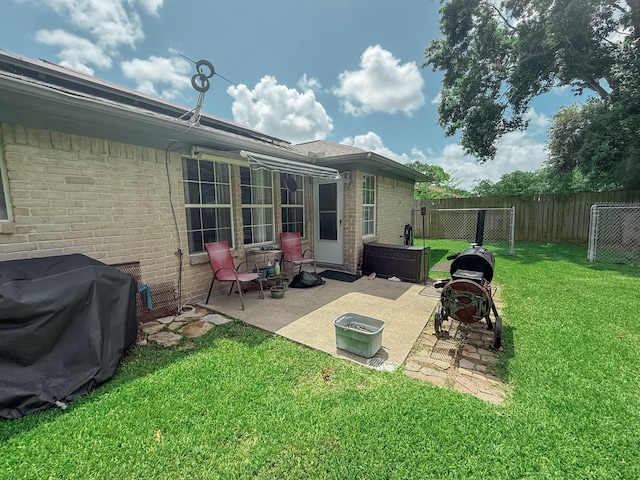 309 Baycrest Dr, League City, TX 77573 - back of property with brick siding, a patio, and a hot tub