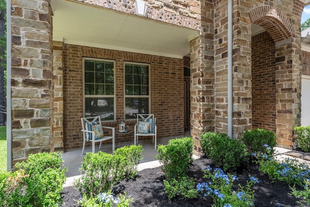 14 Painted Post Pl, The Woodlands, TX 77389 - view of exterior entry featuring brick siding