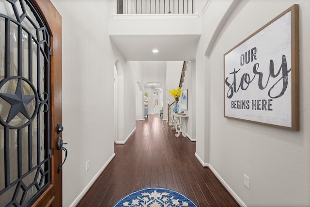14 Painted Post Pl, The Woodlands, TX 77389 - foyer entrance featuring arched walkways, wood-type flooring, and recessed lighting
