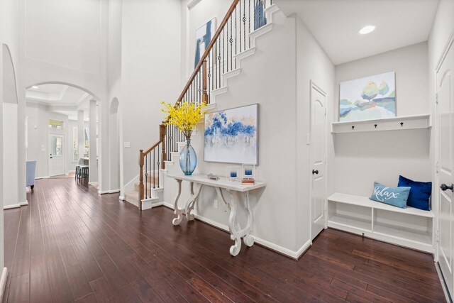 14 Painted Post Pl, The Woodlands, TX 77389 - entryway featuring arched walkways, stairs, wood-type flooring, and recessed lighting