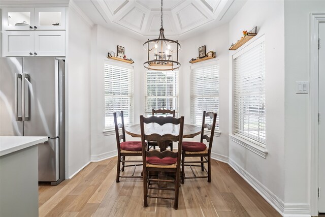 6602 Ranch Park Dr, Magnolia, TX 77354 - dining area with light wood-style floors, plenty of natural light, coffered ceiling, and a chandelier