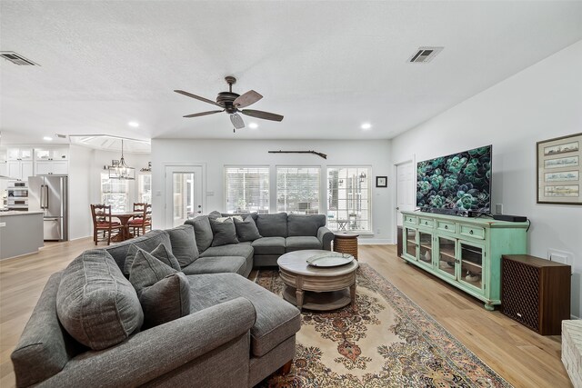 6602 Ranch Park Dr, Magnolia, TX 77354 - living area featuring ceiling fan, a chandelier, light wood-style floors, and recessed lighting