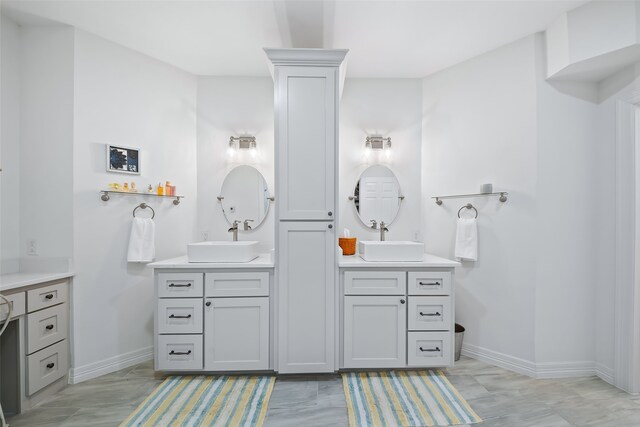 6602 Ranch Park Dr, Magnolia, TX 77354 - full bath featuring two vanities and baseboards